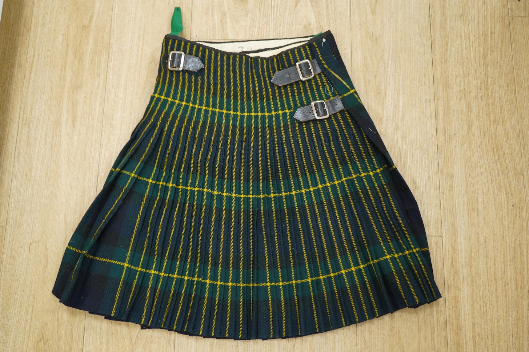 A collection of militaria, etc. including; a Gordon Highlander’s kilt and sporran, three early 20th century Union Flags, a Victorian beaded ‘sweetheart’s’ cushion, two empty First World War Princess Mary Christmas tins,